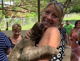 Tina Napolitano holding a baby sloth