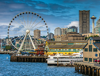 Seattle Washingon Seattle, Washington city and foliage in front of a sunset